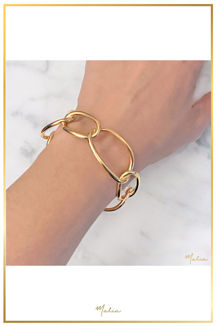 Pulsera Cuff Aros Entrelazados en Chapa de Oro